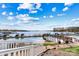 Stunning lake view with a wooden dock and lush green lawn in the foreground at 7831 Spinnaker Bay Dr # 314, Sherrills Ford, NC 28673