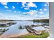 Scenic view of Lake Norman with a boat dock under a blue sky and fluffy clouds at 7831 Spinnaker Bay Dr # 314, Sherrills Ford, NC 28673