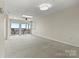 Spacious living room with natural light and access to a private balcony overlooking the water at 7831 Spinnaker Bay Dr # 314, Sherrills Ford, NC 28673