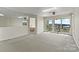 Expansive living room with serene water views, balcony access, and an adjacent bedroom at 7831 Spinnaker Bay Dr # 314, Sherrills Ford, NC 28673