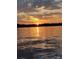 A stunning view of a lake at sunset, casting vibrant orange and yellow hues across the water at 7831 Spinnaker Bay Dr # 314, Sherrills Ford, NC 28673