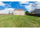 Large grassy backyard enclosed by a wooden fence, perfect for outdoor activities at 1114 Fenwick Ct, Clover, SC 29710