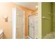 Bright bathroom featuring a glass door shower and white fixtures at 1114 Fenwick Ct, Clover, SC 29710