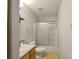 Well-lit bathroom featuring a stand-up shower behind sliding glass doors at 1114 Fenwick Ct, Clover, SC 29710