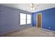 Clean blue bedroom with carpet, white ceiling fan, and double window at 1114 Fenwick Ct, Clover, SC 29710