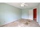 Bedroom featuring neutral carpet, a ceiling fan, and a door to another room at 1114 Fenwick Ct, Clover, SC 29710