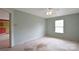 Bedroom featuring neutral carpet, a ceiling fan, and a window for natural light at 1114 Fenwick Ct, Clover, SC 29710