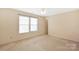 Neutral bedroom with carpet, ceiling fan, and double window letting in ample light at 1114 Fenwick Ct, Clover, SC 29710