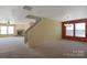 Spacious open-concept living room featuring a cozy fireplace and ample natural light, ideal for entertaining guests or relaxing at 1114 Fenwick Ct, Clover, SC 29710