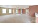 Spacious living room with neutral carpet, multiple windows, and fresh paint at 1114 Fenwick Ct, Clover, SC 29710