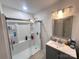 Clean bathroom with walk-in shower and gray vanity at 1210 Butler St, Salisbury, NC 28144