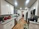 Modern kitchen featuring granite countertops and white cabinets at 1210 Butler St, Salisbury, NC 28144