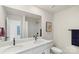 Bathroom with double vanity, shower, and white cabinets at 16042 River Tree Ln, Charlotte, NC 28278