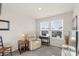 Bedroom with recliner, window seating, and TV at 16042 River Tree Ln, Charlotte, NC 28278