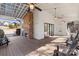 Covered patio with fireplace and seating at 16042 River Tree Ln, Charlotte, NC 28278