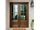 Elegant double front doors with glass panels and views to the outdoors at 2007 Kendall Dr # 6, Wesley Chapel, NC 28173