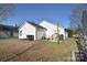 Spacious backyard with a playhouse, patio, and a well-maintained lawn at 3076 Champion Sw Ln, Concord, NC 28025