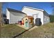 Cozy backyard featuring a playhouse, patio, and well-maintained lawn at 3076 Champion Sw Ln, Concord, NC 28025