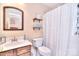 Cozy bathroom featuring a wooden vanity, a commode, and a shower and tub combo at 3076 Champion Sw Ln, Concord, NC 28025