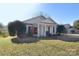 Charming single-story home with a well-manicured lawn and inviting front porch at 3076 Champion Sw Ln, Concord, NC 28025