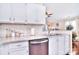 Bright kitchen featuring stainless steel appliances, granite countertops, and white subway tile backsplash at 3076 Champion Sw Ln, Concord, NC 28025