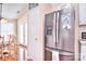 Eat-in kitchen area boasting stainless steel refrigerator and access to the outdoor patio at 3076 Champion Sw Ln, Concord, NC 28025