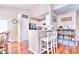 Bright kitchen with white cabinetry, granite countertops, and modern appliances at 3076 Champion Sw Ln, Concord, NC 28025