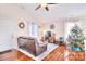Bright and airy living room with hardwood floors, cozy furnishings and plenty of natural light at 3076 Champion Sw Ln, Concord, NC 28025