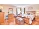 Spacious main bedroom with hardwood floors, sitting area, and an ensuite bathroom at 3076 Champion Sw Ln, Concord, NC 28025