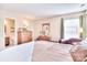 Bright main bedroom featuring a seating area near the window and an ensuite bathroom at 3076 Champion Sw Ln, Concord, NC 28025