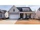 Charming home featuring a two-car garage, covered porch, and landscaped yard at 3611 Whitney Way, Terrell, NC 28682