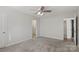 Spacious bedroom with ceiling fan and neutral carpeting at 375 Sweetgum Dr, Fort Mill, SC 29715