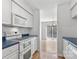 View of kitchen with white cabinets, blue countertops, and stove at 375 Sweetgum Dr, Fort Mill, SC 29715