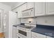 White appliances and blue countertops in this galley kitchen at 375 Sweetgum Dr, Fort Mill, SC 29715