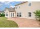 View of the home's rear exterior showcasing a patio area and well-maintained yard at 11005 Magna Ln, Indian Trail, NC 28079