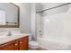 Bathroom featuring tub and shower, vanity, and framed mirror at 11005 Magna Ln, Indian Trail, NC 28079