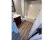 Cozy bathroom features wood-look flooring, a vanity with a sink, toilet, and a shower-tub combo with white walls at 11005 Magna Ln, Indian Trail, NC 28079