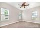 Bedroom with carpet, ceiling fan, and windows for natural light at 11005 Magna Ln, Indian Trail, NC 28079