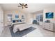Staged bedroom featuring a ceiling fan and ample natural light at 11005 Magna Ln, Indian Trail, NC 28079