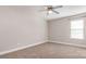 Bright bedroom with natural light from a window and a ceiling fan, offering a cozy atmosphere at 11005 Magna Ln, Indian Trail, NC 28079