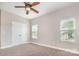 Bedroom featuring carpet, a ceiling fan, and a double door closet at 11005 Magna Ln, Indian Trail, NC 28079