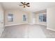 Spacious bedroom with large windows, neutral walls and carpeting, and a ceiling fan for added comfort at 11005 Magna Ln, Indian Trail, NC 28079