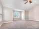 Bright bonus room with natural light from a window and a ceiling fan, offering a cozy atmosphere at 11005 Magna Ln, Indian Trail, NC 28079