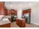 Spacious kitchen featuring wood cabinets, stainless steel refrigerator, and an island at 11005 Magna Ln, Indian Trail, NC 28079
