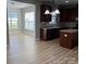Spacious kitchen with stainless steel appliances, wood floors, granite countertops, and ample cabinet space at 11005 Magna Ln, Indian Trail, NC 28079