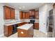 Kitchen boasts an island, dark wood cabinets, and sleek appliances at 11005 Magna Ln, Indian Trail, NC 28079