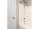 Shower features chrome shower head and faucet with white tiled walls and clear door at 11005 Magna Ln, Indian Trail, NC 28079