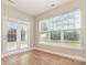 Sunroom featuring an outdoor view from many windows and access to the backyard at 11005 Magna Ln, Indian Trail, NC 28079