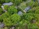 Lush greenery surrounds this charming home, creating a private and serene setting in a desirable neighborhood at 1102 Oak Hill Dr, Monroe, NC 28112