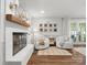 Cozy living area with fireplace, hardwood floors, and comfortable seating at 1102 Oak Hill Dr, Monroe, NC 28112